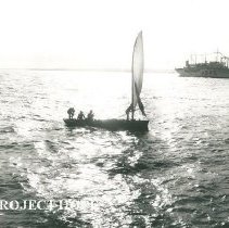 Fishing boat in foreground as SS HOPE arrives in Maceio